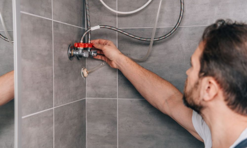 selective-focus-of-male-plumber-repairing-electric-2022-12-08-02-28-53-utc